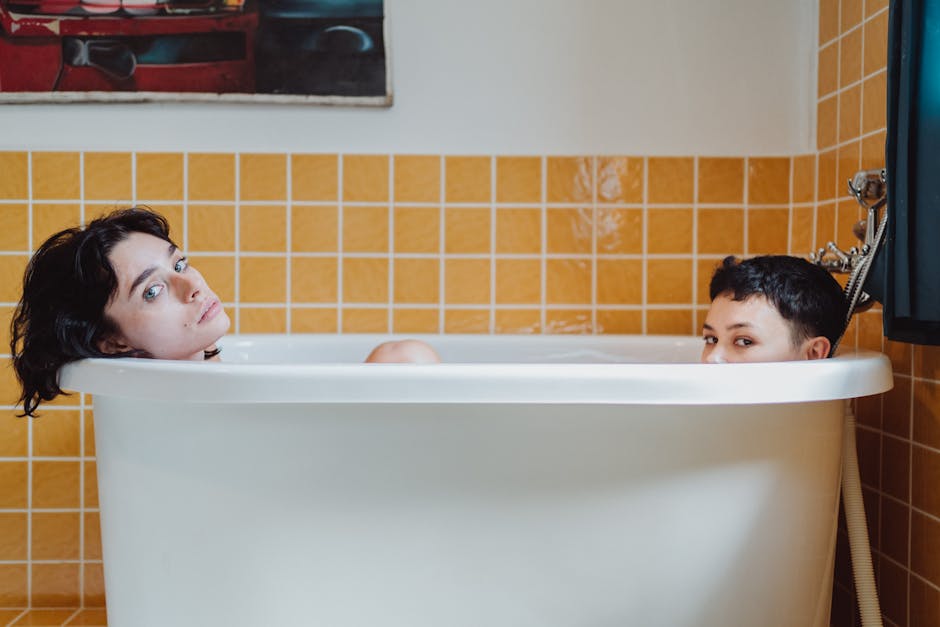 A loving couple enjoys a relaxing bath together, highlighting intimacy and connection.